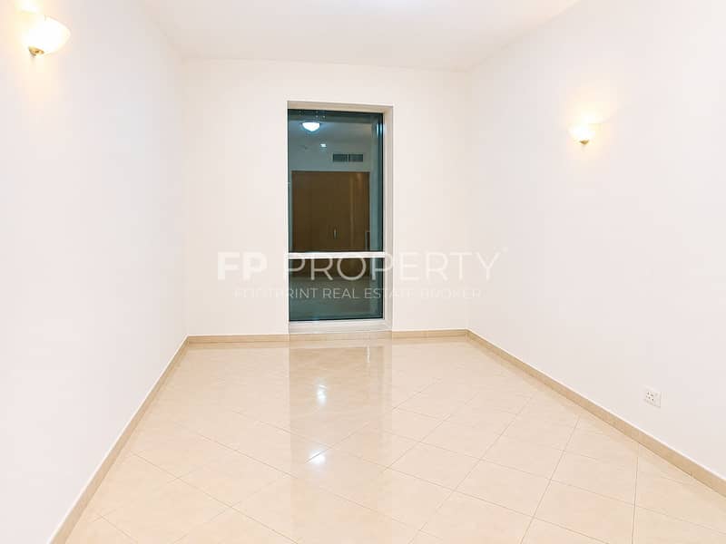 3 Bright Minimalist Room with Glowing Sconces. png