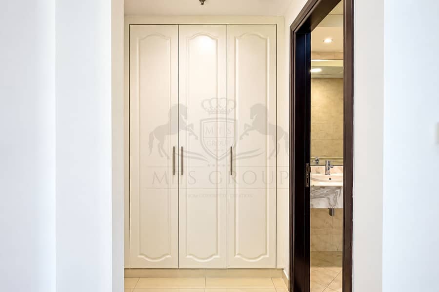 7 Modern Cream Wardrobe and Marble Bathroom. png