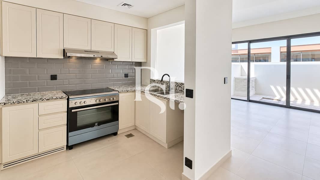 6 Modern Cream Kitchen with Sunlit Terrace. png