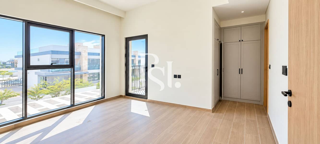 11 Bright Minimalist Bedroom with Balcony Views. png