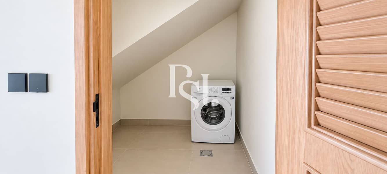 17 Minimal Under-Stairs Laundry Closet. png