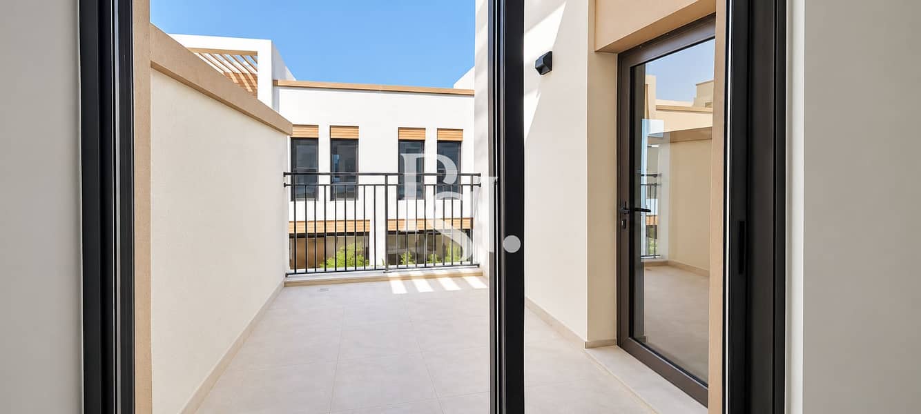 21 Sunlit Minimalist Balcony Courtyard. png