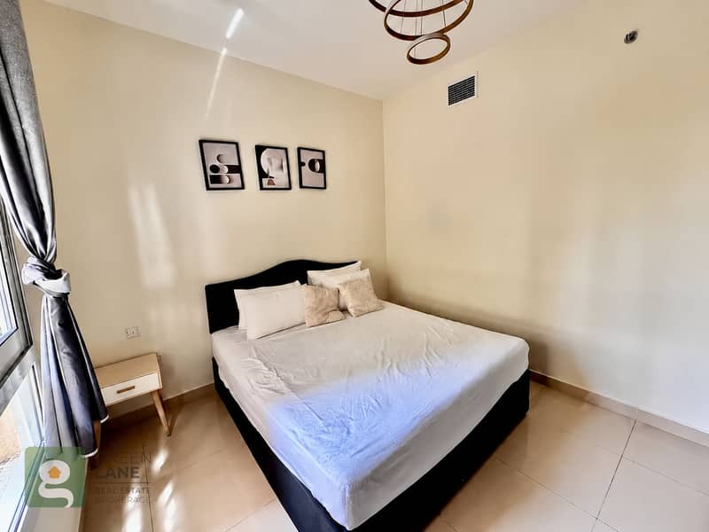 3 Sunlit bedroom with framed artwork-3. png