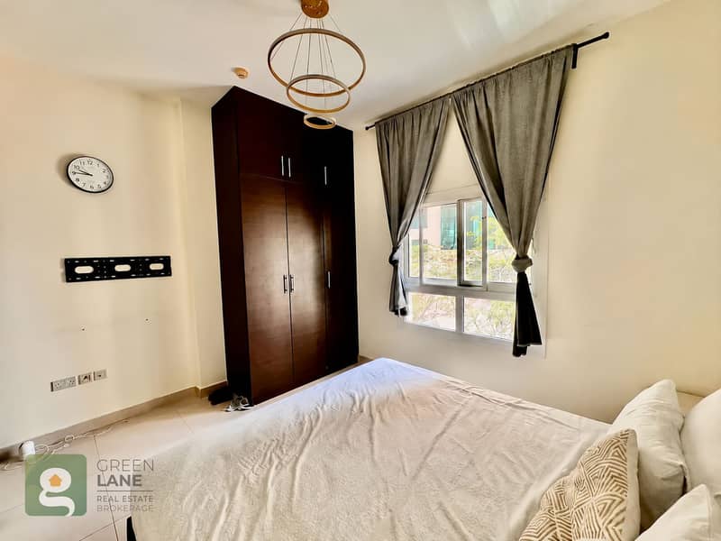 4 Bedroom with dark wardrobe and curtained window-7. png