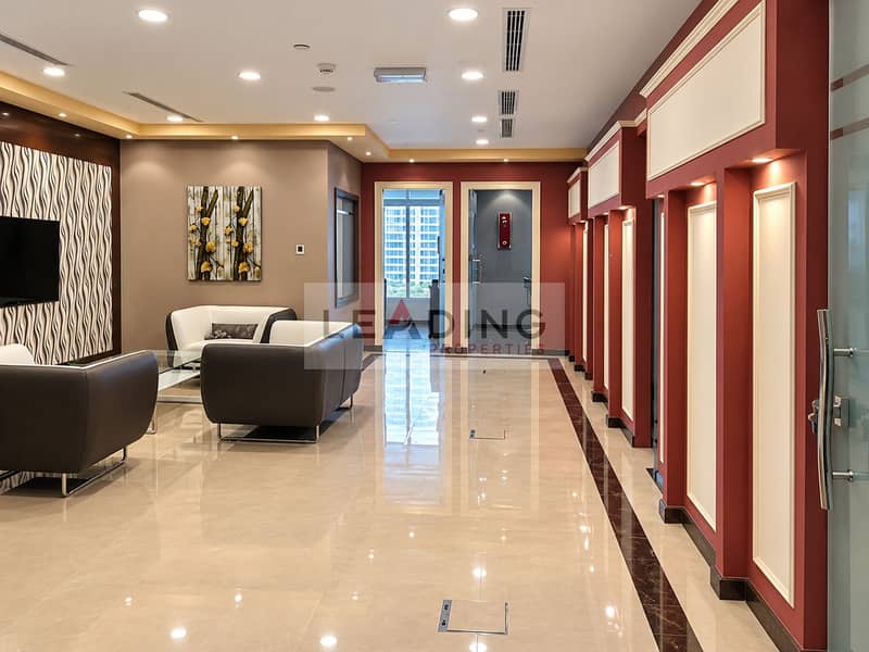 4 Showroom-clean burgundy-accented office lobby (1). png