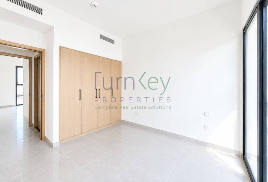 6 Bright Minimalist Room with Oak Wardrobe. png