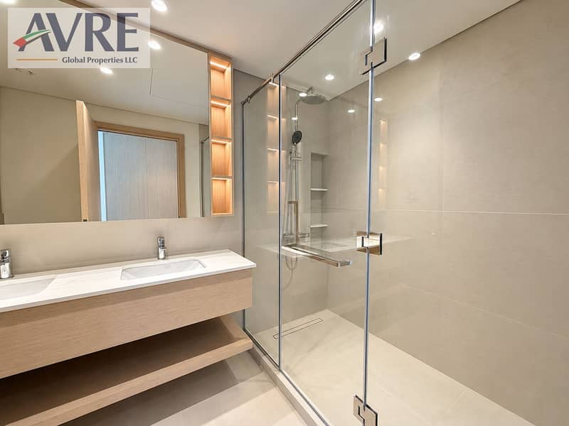 14 Modern Neutral Bathroom with Glass Shower. png