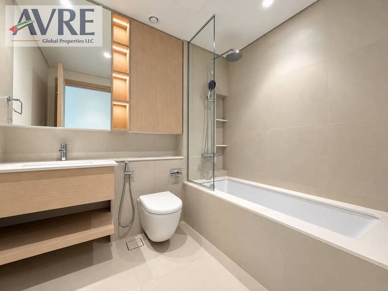 16 Modern Beige Bathroom with Warm Wood Accents. png