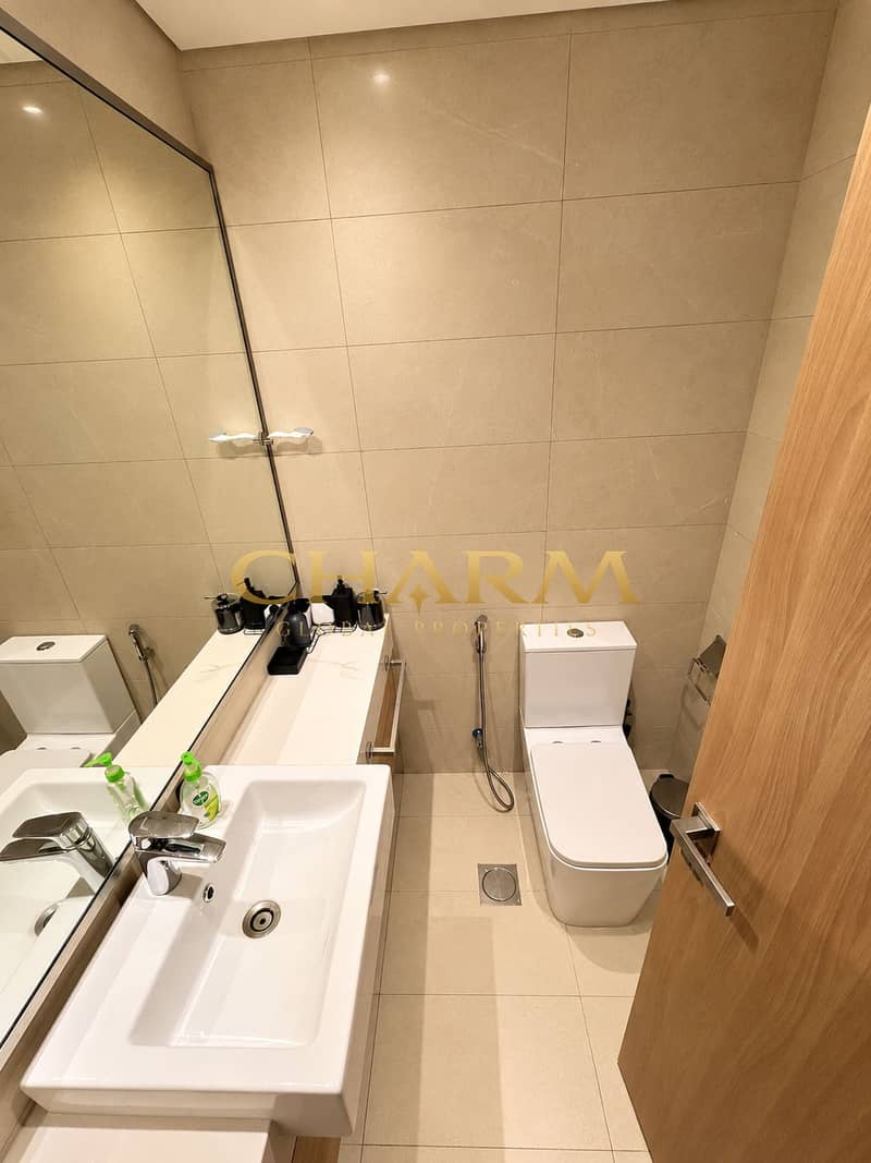 6 Modern Beige Bathroom with Chrome Accents. png