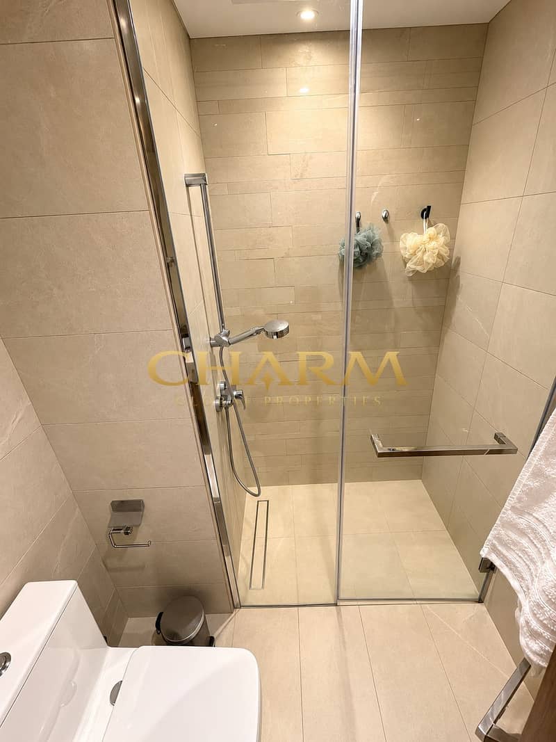 7 Modern Beige Bathroom with Glass Shower. png