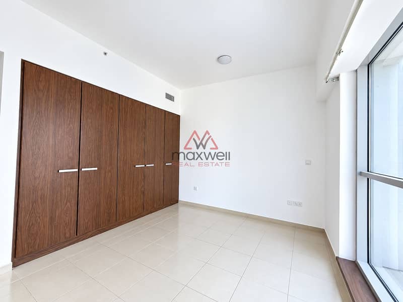 3 Minimalist Empty Bedroom with Walnut Wardrobe. png