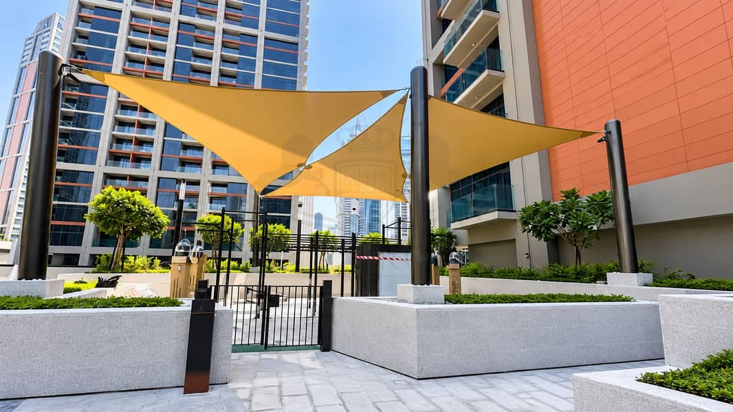 12 Sunlit Courtyard with Shade Sails. png
