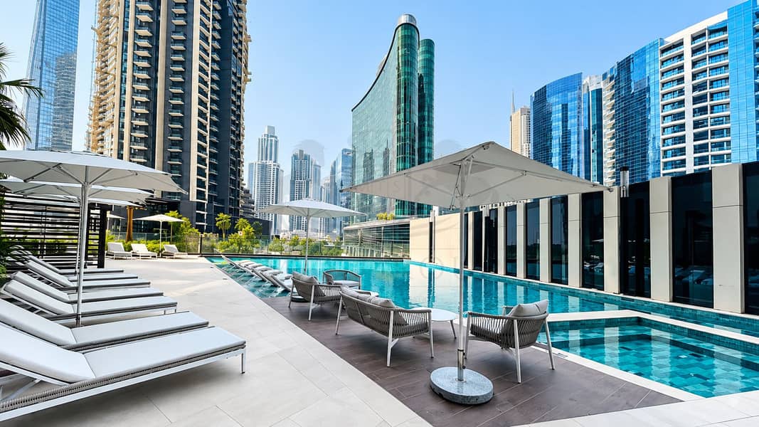 16 Rooftop Pool Amidst the Skyline. png