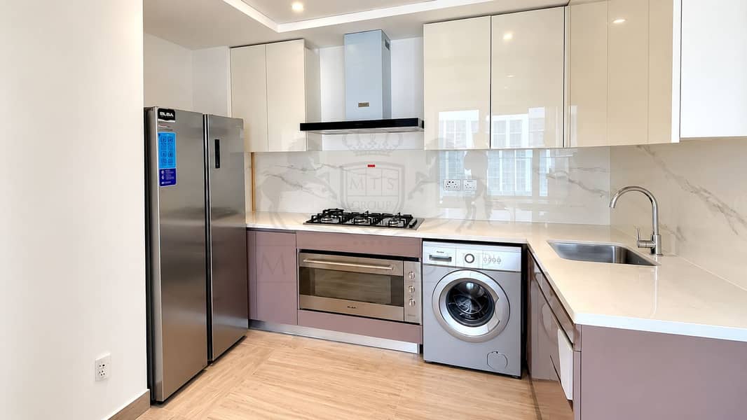 13 Modern Glossy L-Shaped Kitchen. png