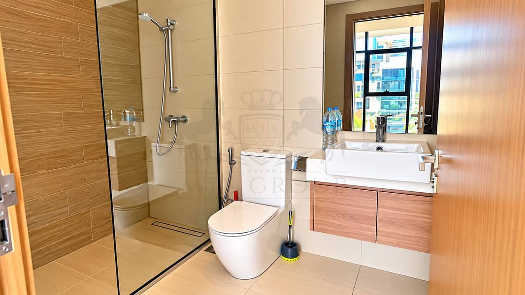 15 Modern Beige Bathroom with Wood Vanity. png