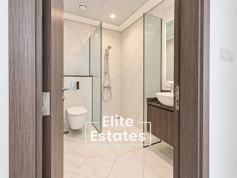10 Modern Marble Bathroom Through Open Doorway. png