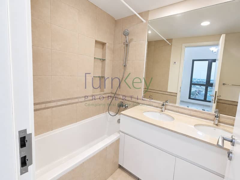 7 Bright Beige-Tiled Modern Bathroom. png
