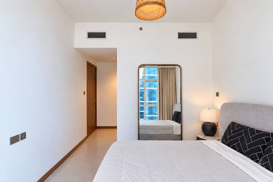 12 Minimalist Bedroom with Rattan Pendant and Mirror (1). png