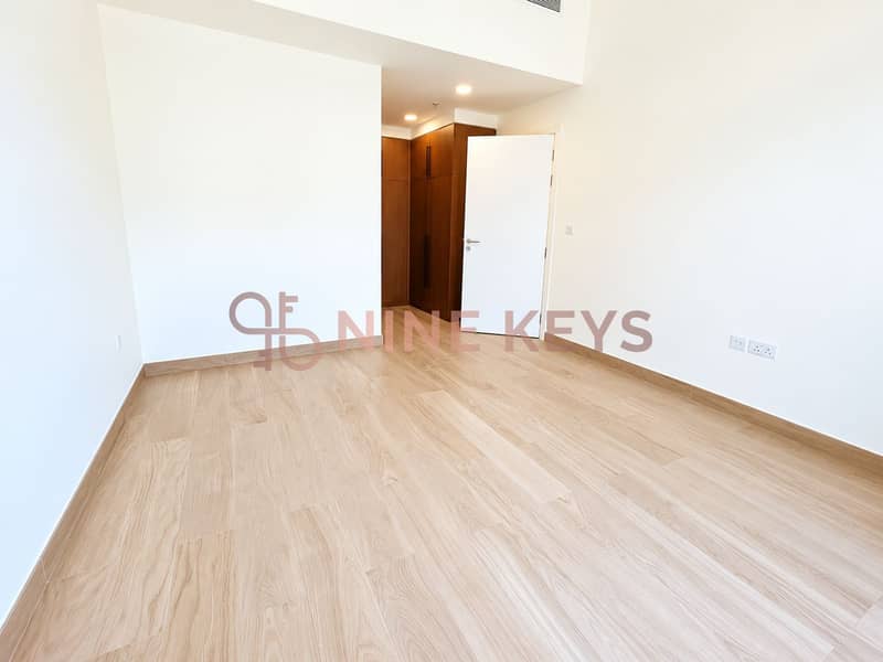 4 Bright Minimalist Room with Open Closet. png