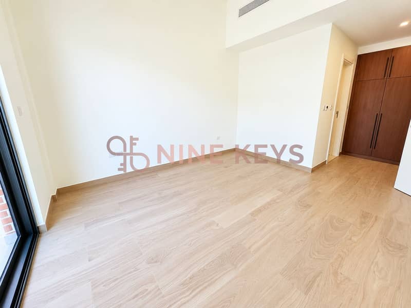 5 Bright Minimalist Room with Wood Flooring. png