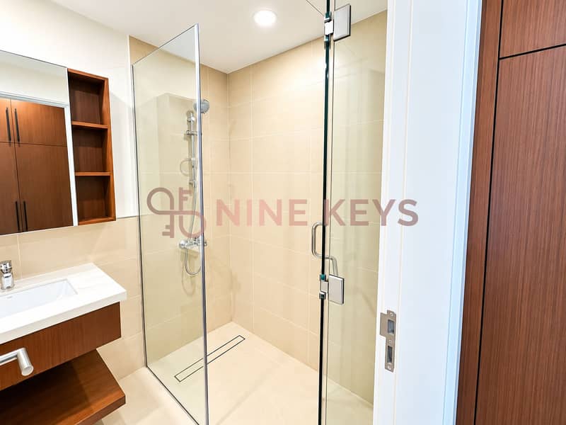 6 Bright Modern Beige-Tiled Bathroom. png