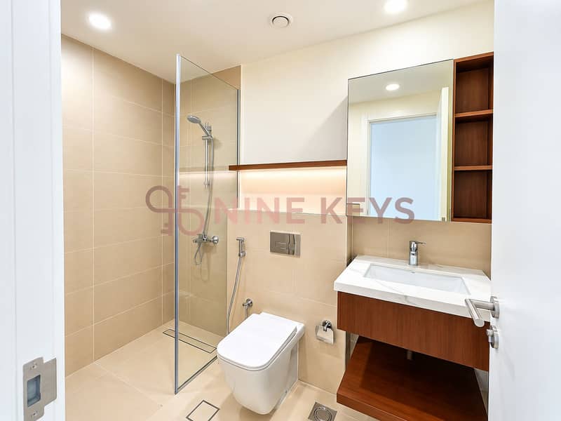8 Minimalist Beige Bathroom with Warm Wood Accents. png