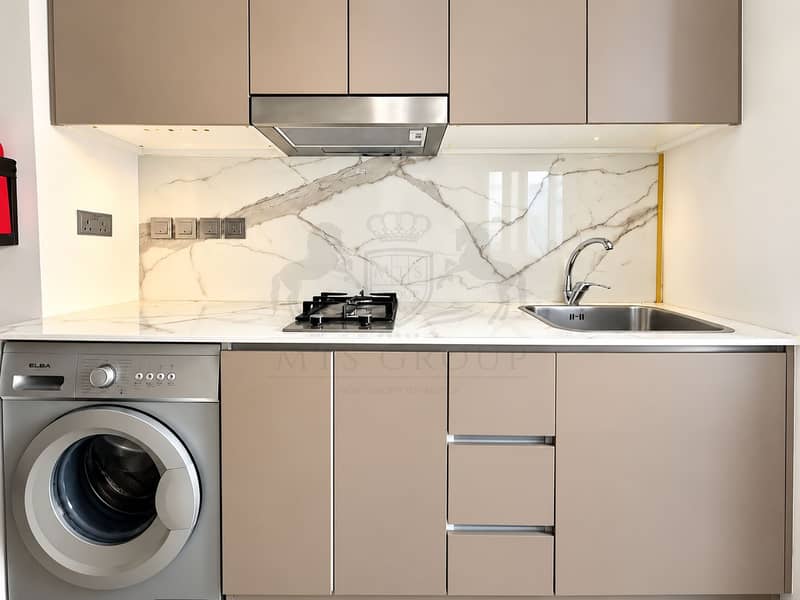 9 Modern Taupe Kitchen with Marble Backsplash. png