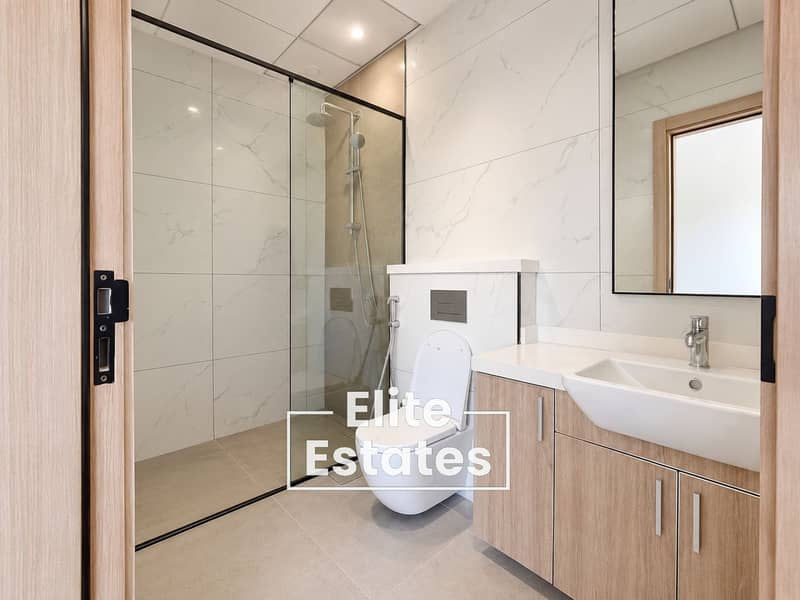7 Modern Marble-Tiled Bathroom Interior (1). png