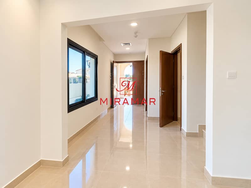 9 Bright Modern Hallway with Open Doors. png