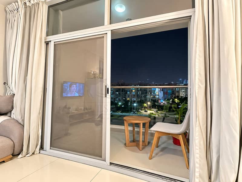 4 Nighttime Balcony View from a Modern Living Room. png