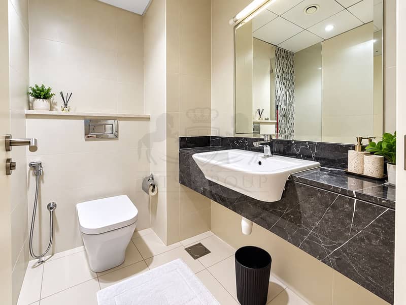 5 Bright Modern Beige Tiled Bathroom. png
