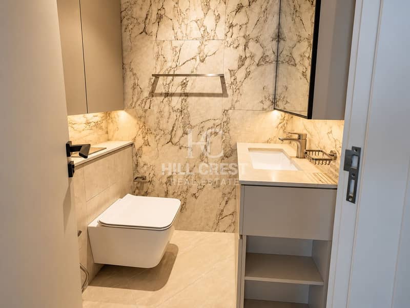 9 Luxurious Warm Marble Powder Room. png