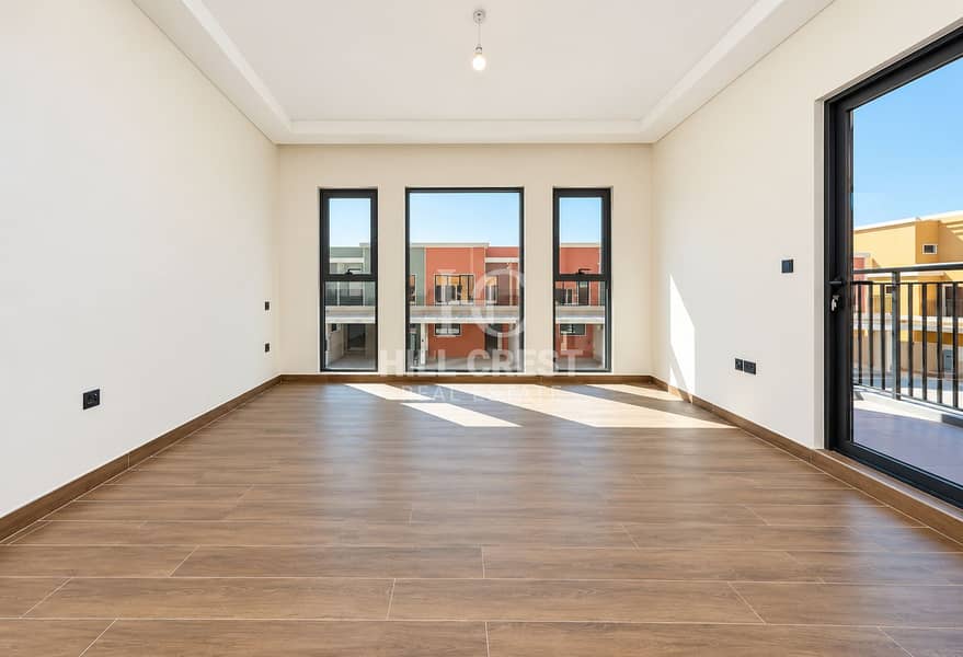 5 Sunlit Modern Room with Balcony Views. png