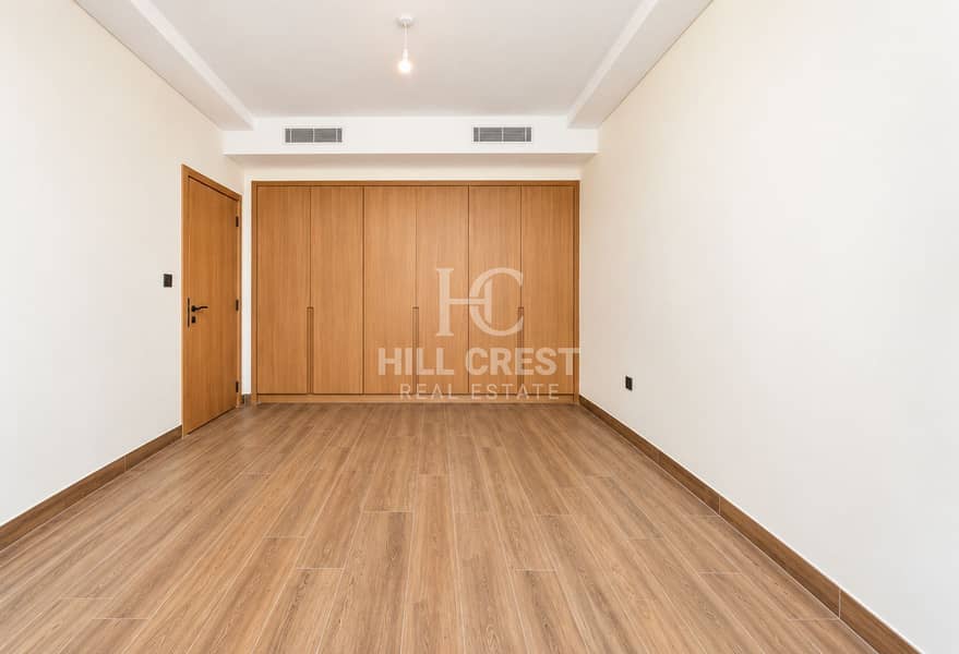 9 Minimalist Room with Built-In Wooden Wardrobe. png