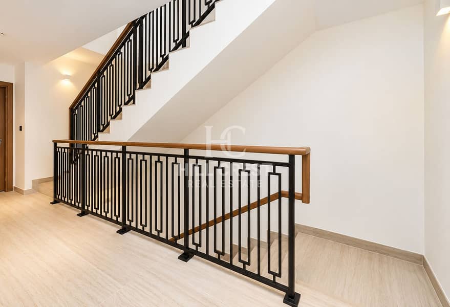 12 Modern Staircase Landing with Geometric Railing. png