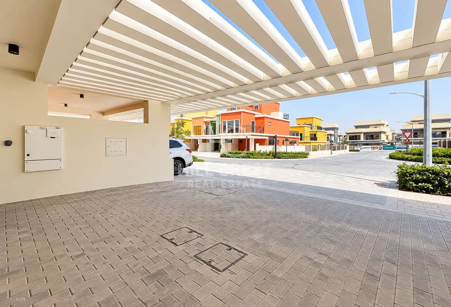 13 Modern Carport Overlooking Colorful Townhouses. png