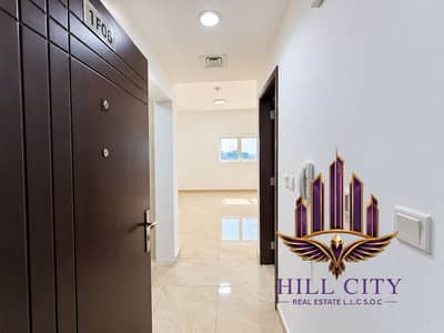 استوديو  للايجار في مردف، دبي - Polished hallway with open brown door. png