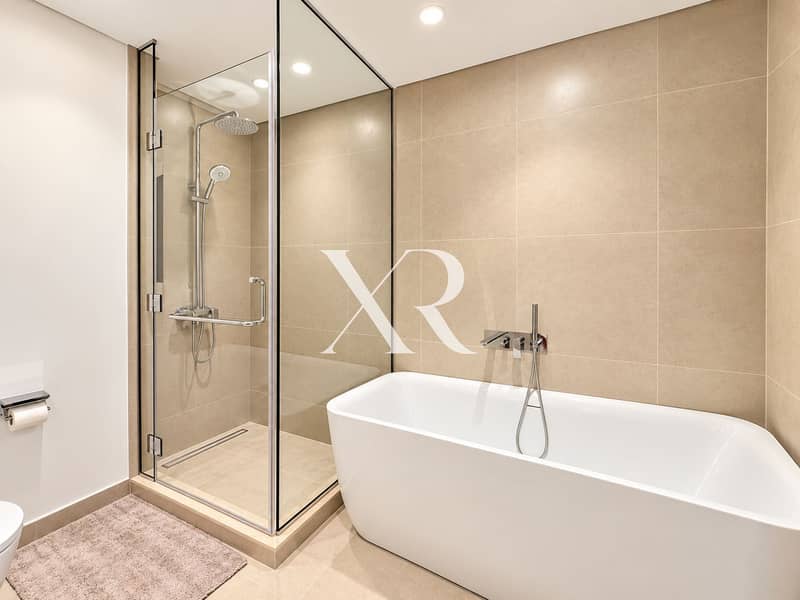 13 Modern Beige Bathroom with Glass Shower and Tub. png