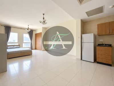 Studio te Huur in Jumeirah Village Circle (JVC), Dubai - Bright Minimal Studio Apartment with Bed and Kitchenette. png Studio te Huur in Jumeirah Village Circle (JVC), Dubai - Bright Minimal Studio Apartment with Bed and Kitchenette. png