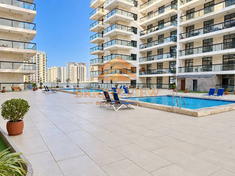 36 Sunlit building amenities by the pool-2. png