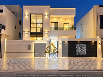 5 Camere Villa in vendita a Al Amerah, Ajman - فيلا عصرية مضاءة ليلاً. jpg