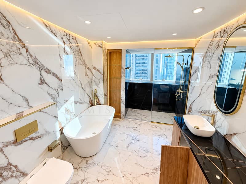 17 Luxury Marble Bathroom with City Views. png
