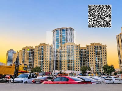 2 Schlafzimmer Wohnung zum Miete in Ajman Downtown, Ajman - Sunrise Cityscape with QR Code. png