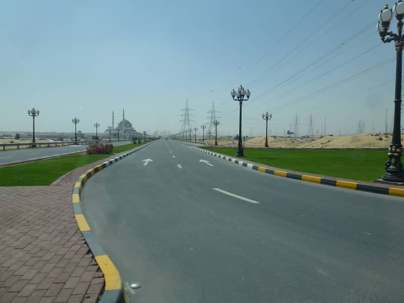 Land for sale in AL Tai area of Sharjah, in cash and installments, for citizens and Arabs free hold and for foreign investment for a period of 99 years