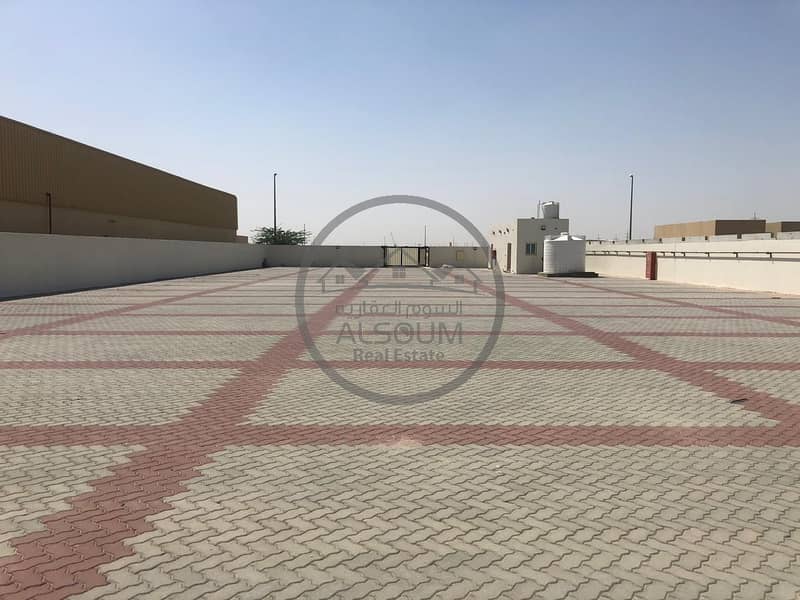INDUSTRIAL YARD AVAILABLE IN SAJAA WITH INTERLOCK , FOR COMMERCIAL AND INDUSTRIAL STORAGE PURPOSE