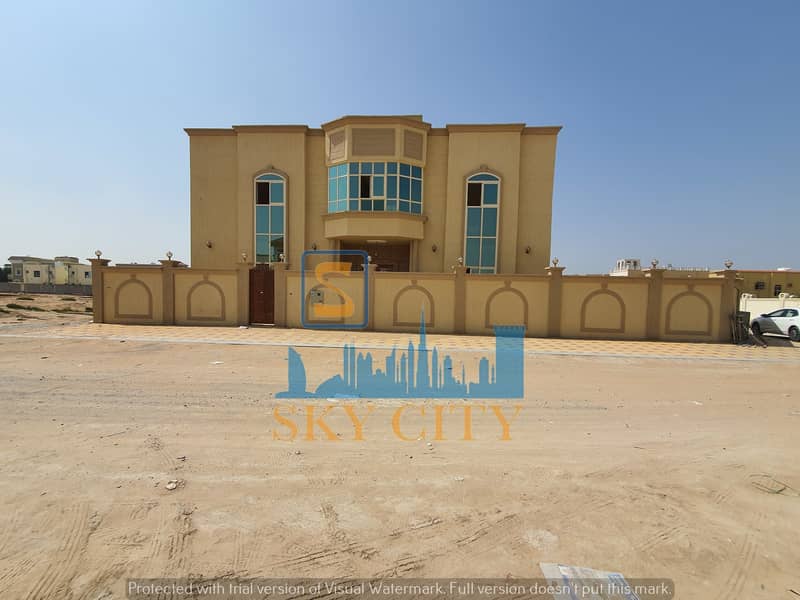 For sale villa, directly opposite the mosque, two streets corner, an internal staircase for the roof, 6 bedrooms, behind Nesto Mall