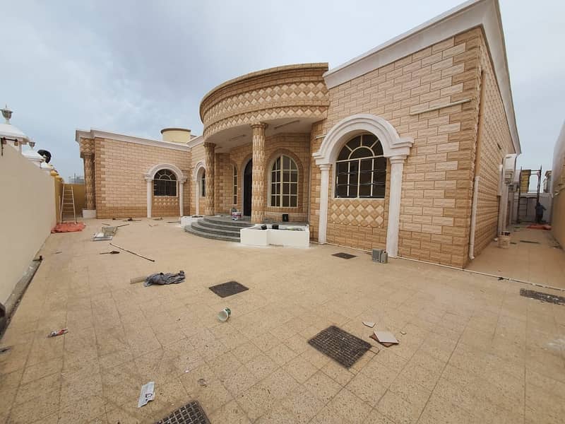 Villa for rent in Al-Jurf area, Ajman, with a stone finish and a competitive price.
