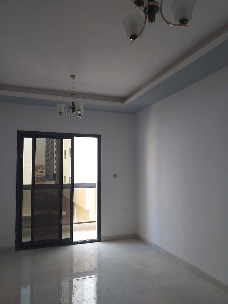 New studio for rent, first inhabitant, in Ajman Al Hamidiyah, excellent location, opposite the court, excellent area + balcony.