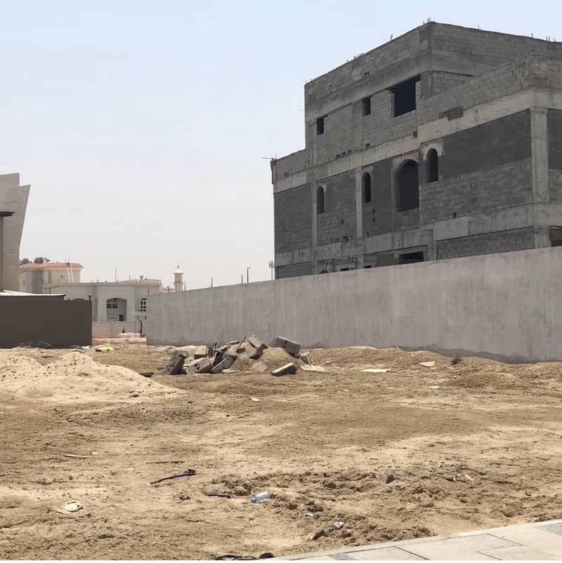 Residential land for sale, Khalifa City, a corner and public street