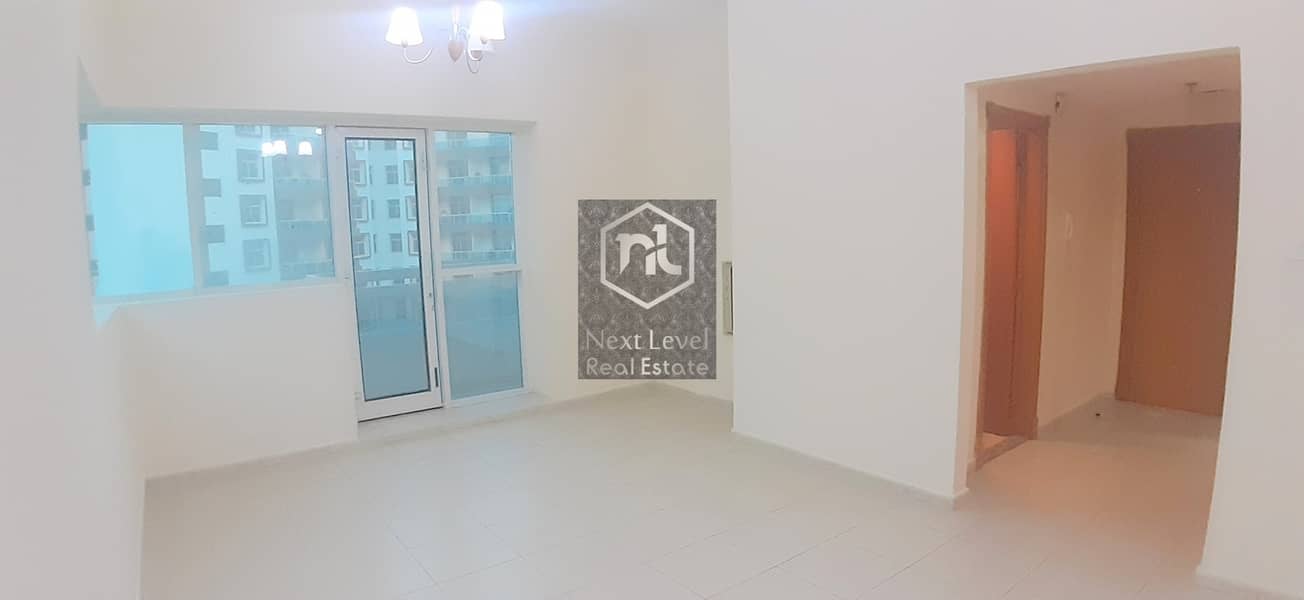 2  VACANT ONE BED ROOM+BALCONY+PARKING+CLOSE KITCHEN IN AXIS RESIDENCE 2 SILICON OASIS